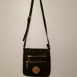 MK black purse with adjustable strap